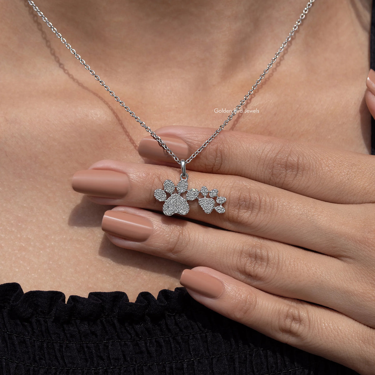 Silver-tone chain necklace with paw-cluster pendant of round-cut sparkling stones