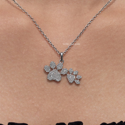 Close-up paw-cluster pendant on silver-tone chain, round-cut sparkling stones