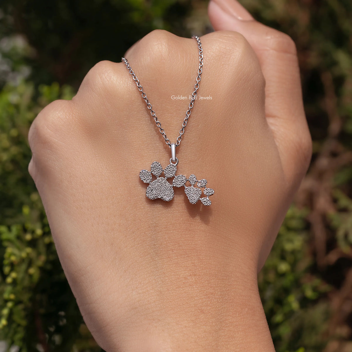 Silver-tone chain necklace with three-paw cluster pendant, round-cut sparkling stones