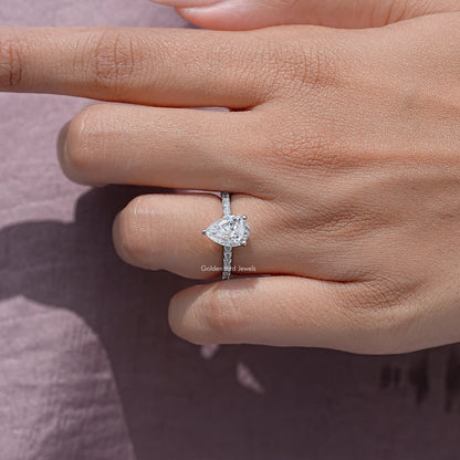 Sterling silver pear-cut moissanite solitaire ring, angled view of center stone