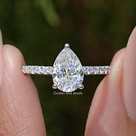 Sterling silver pear-cut solitaire moissanite ring with two-row side accent stones