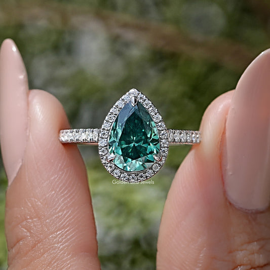 Pear-cut green moissanite halo ring with pavé band in sterling silver