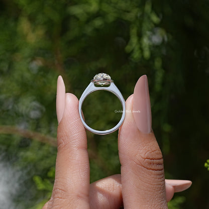 Pear-cut moissanite halo engagement ring back view, open band with top halo
