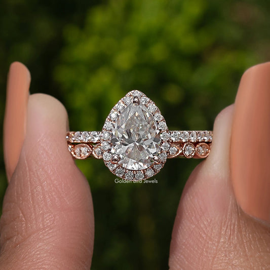 Pear cut moissanite halo bridal ring set with pavé band