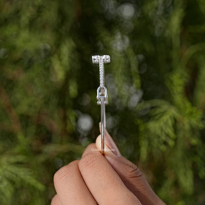 Silver bangle bracelet with pavé diamond clasp detail, shown in side view