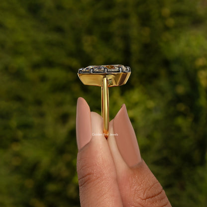 Bezel-set pear-cut gemstone engagement ring, top view of setting