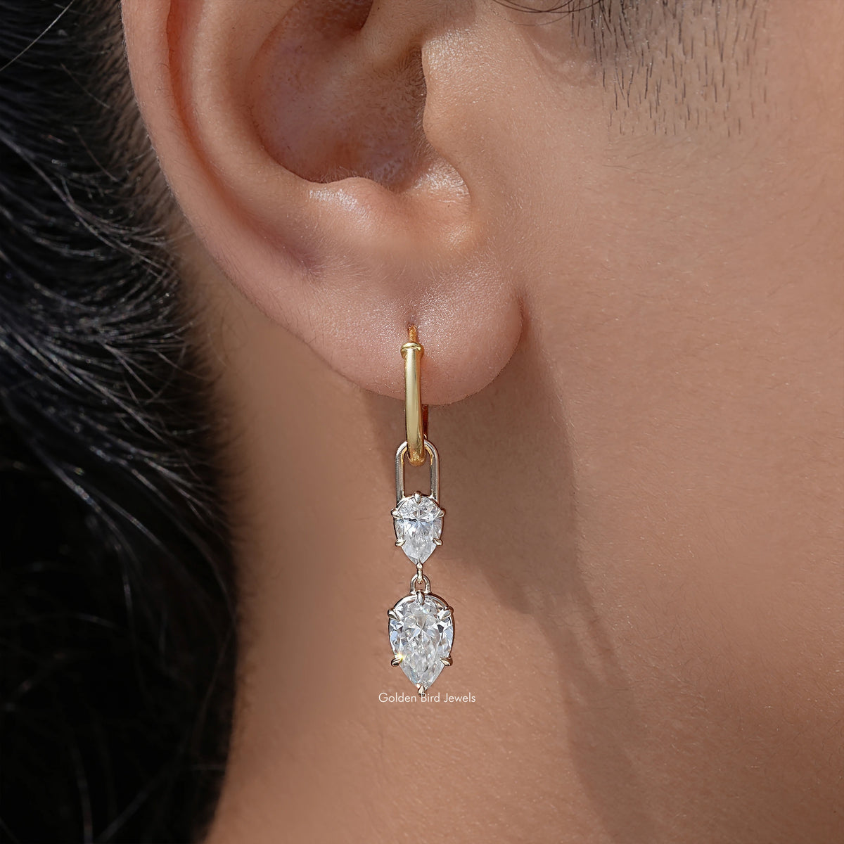 Gold-tone hoop dangle earrings with two pear-cut clear stones