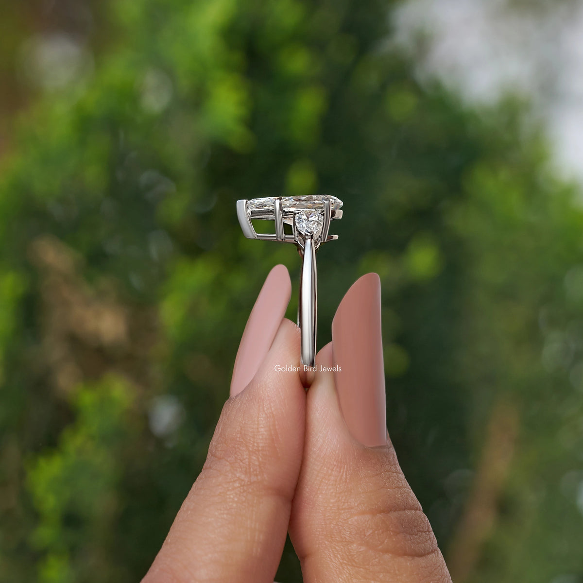Three-stone pear-cut diamond engagement ring, silver split-prong setting
