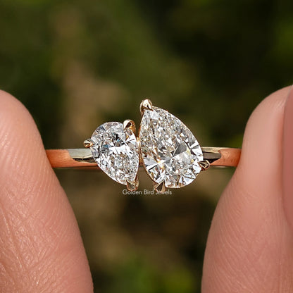 Gold pear-shaped two-stone lab diamond ring with slim band, two prong-set stones.