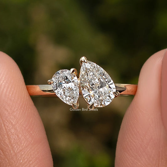 Gold pear-shaped two-stone lab diamond ring with slim band, two prong-set stones.
