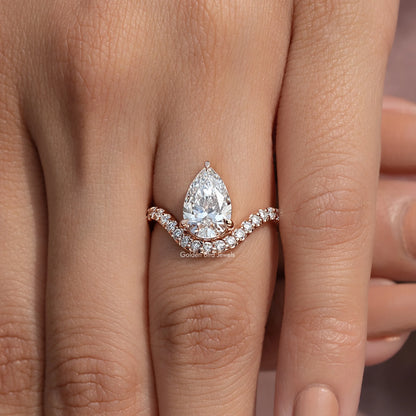 Pear-cut lab-grown diamond engagement ring with curved accent band