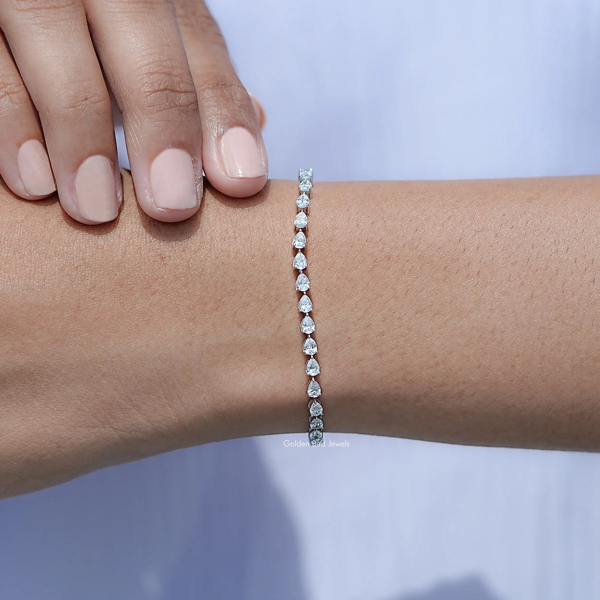 In hand Showing View Pear Cut Diamond Tennis Steel Bracelet
