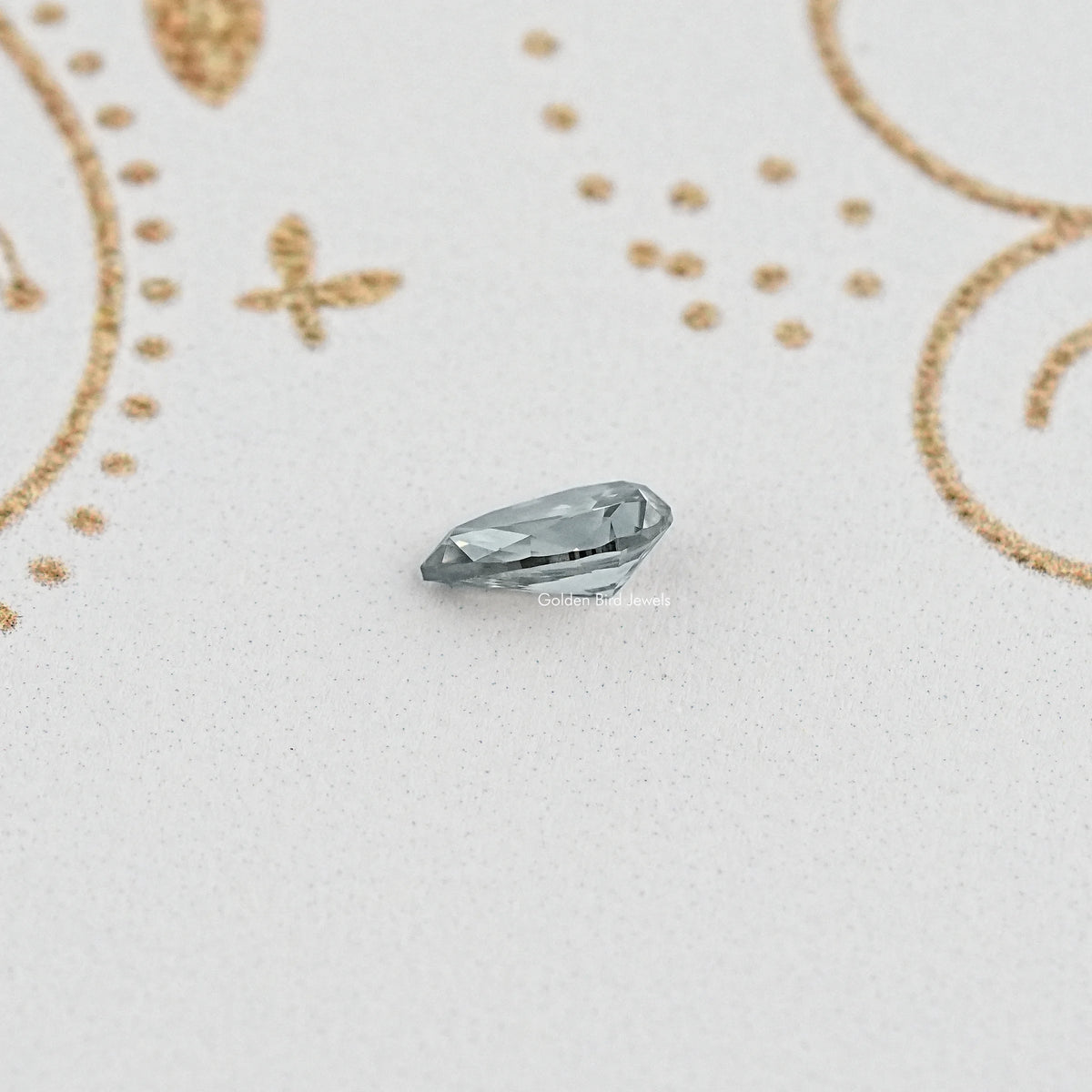 Side View of gray pear moissanite showing facets and shape
