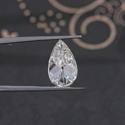 In Tweezer View Of Old Mine Pear Cut Loose Moissanite Stone