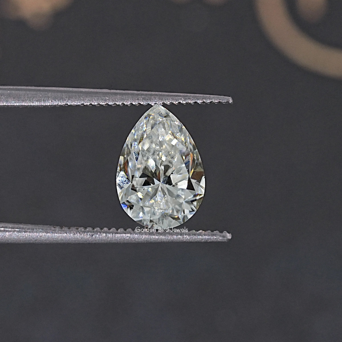 Near colorless pear-cut moissanite loose gemstone, close-up side view