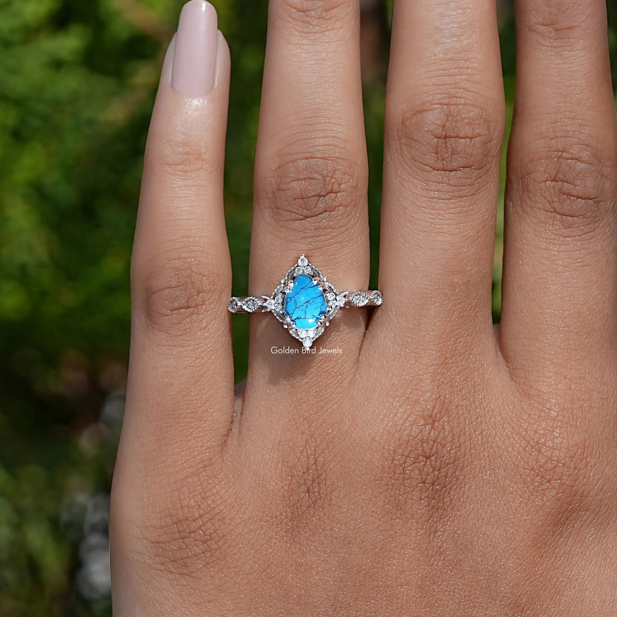 Detailed View of Pear Shape Gemstone Accent Ring In White Gold