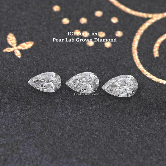 Three pear-cut loose lab diamonds, clear white, faceted teardrop shapes