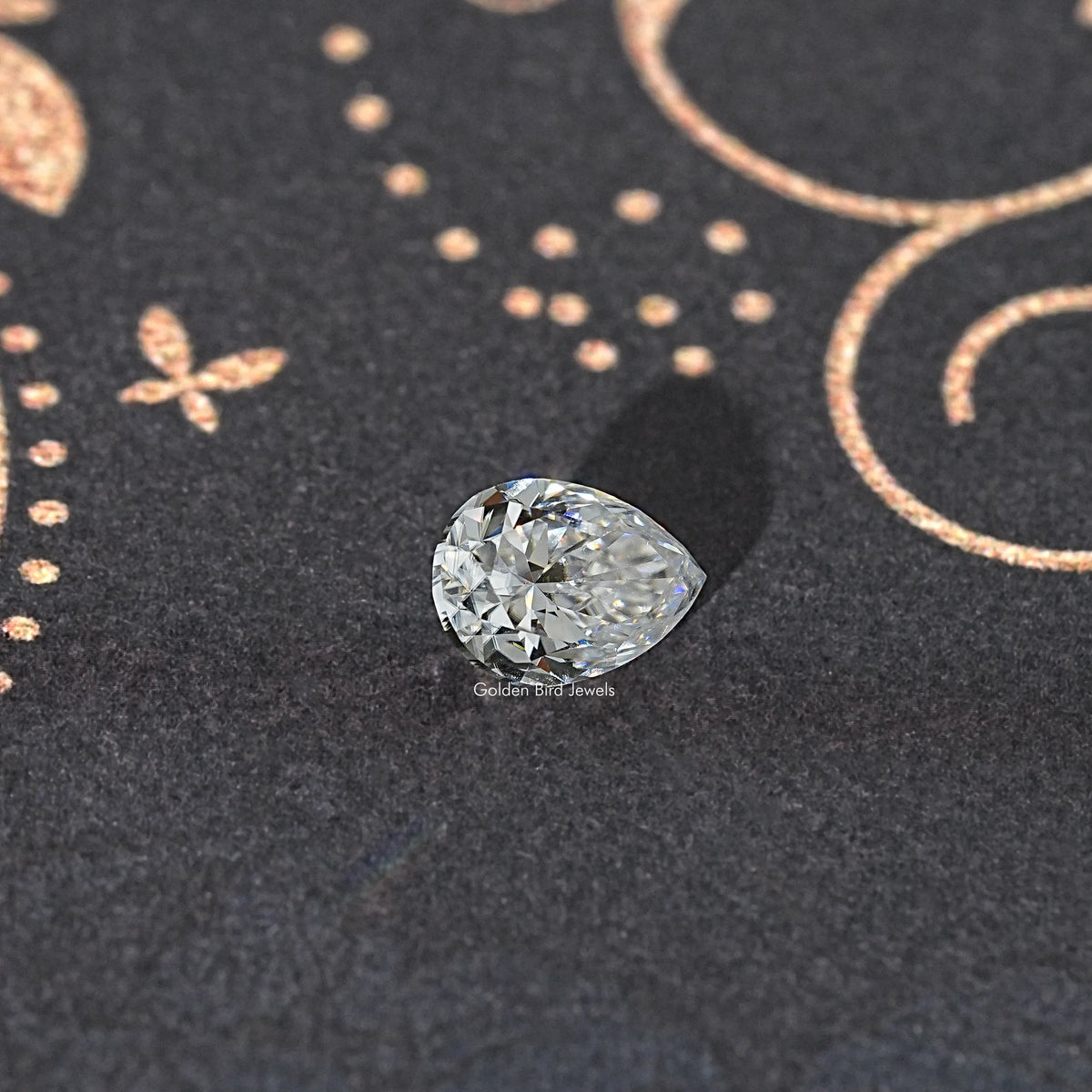 Near colorless pear-cut moissanite loose gemstone on dark background