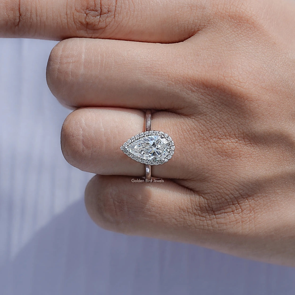 Close View Of Pear Lab Diamond Halo Engagement Ring