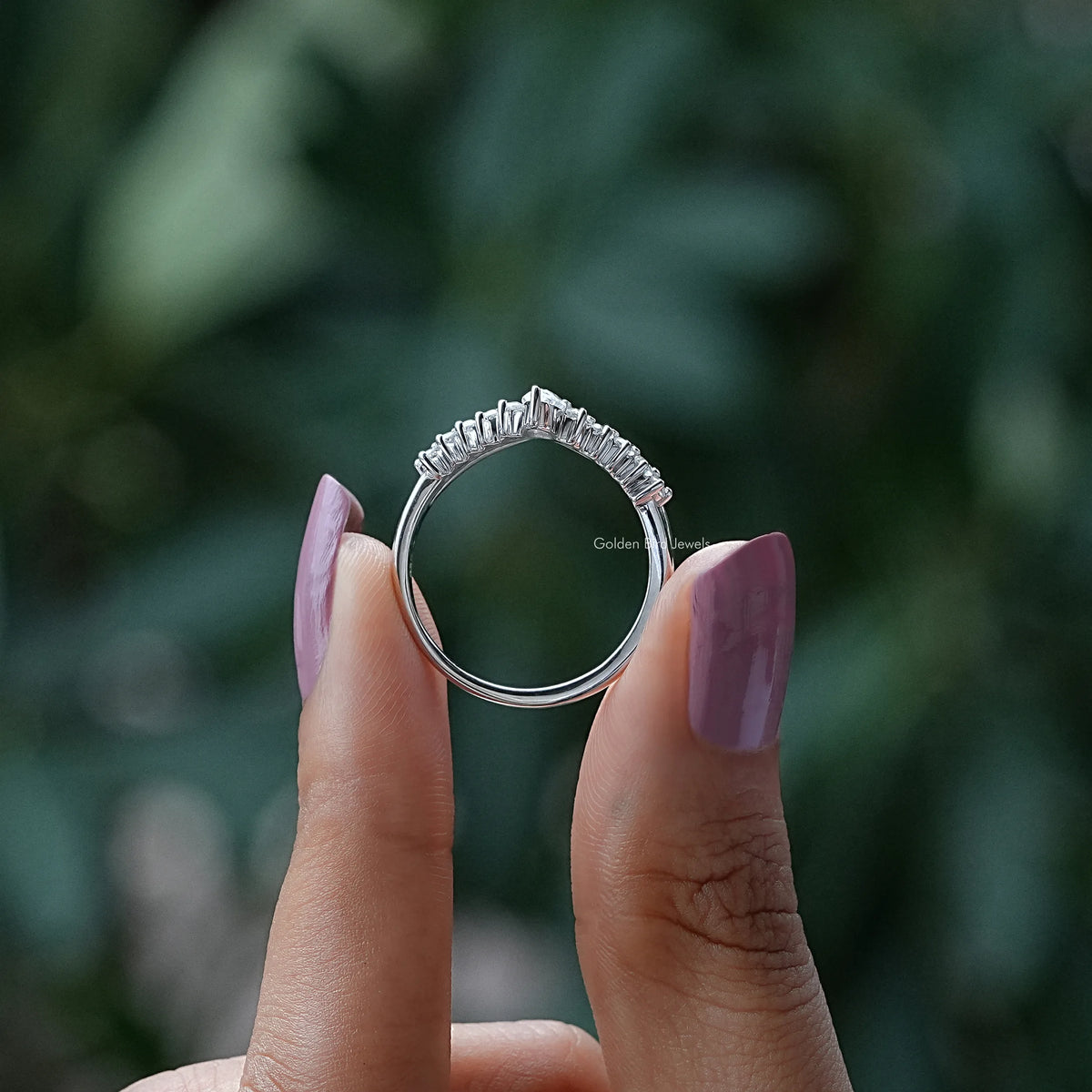 Silver round-collared chevron wedding band, top view with prong-set stones