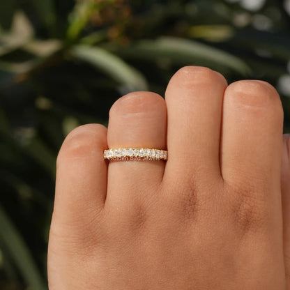 Moissanite half-eternity stacking ring on finger, prong-set stone row