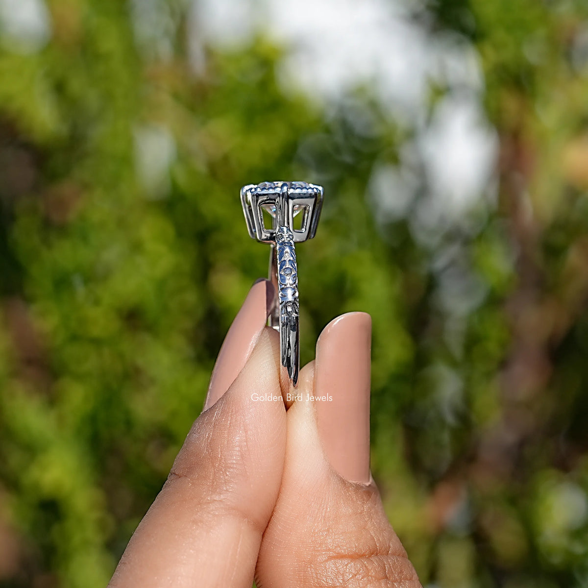 Moissanite solitaire ring showing the raised basket with four-prong center mount