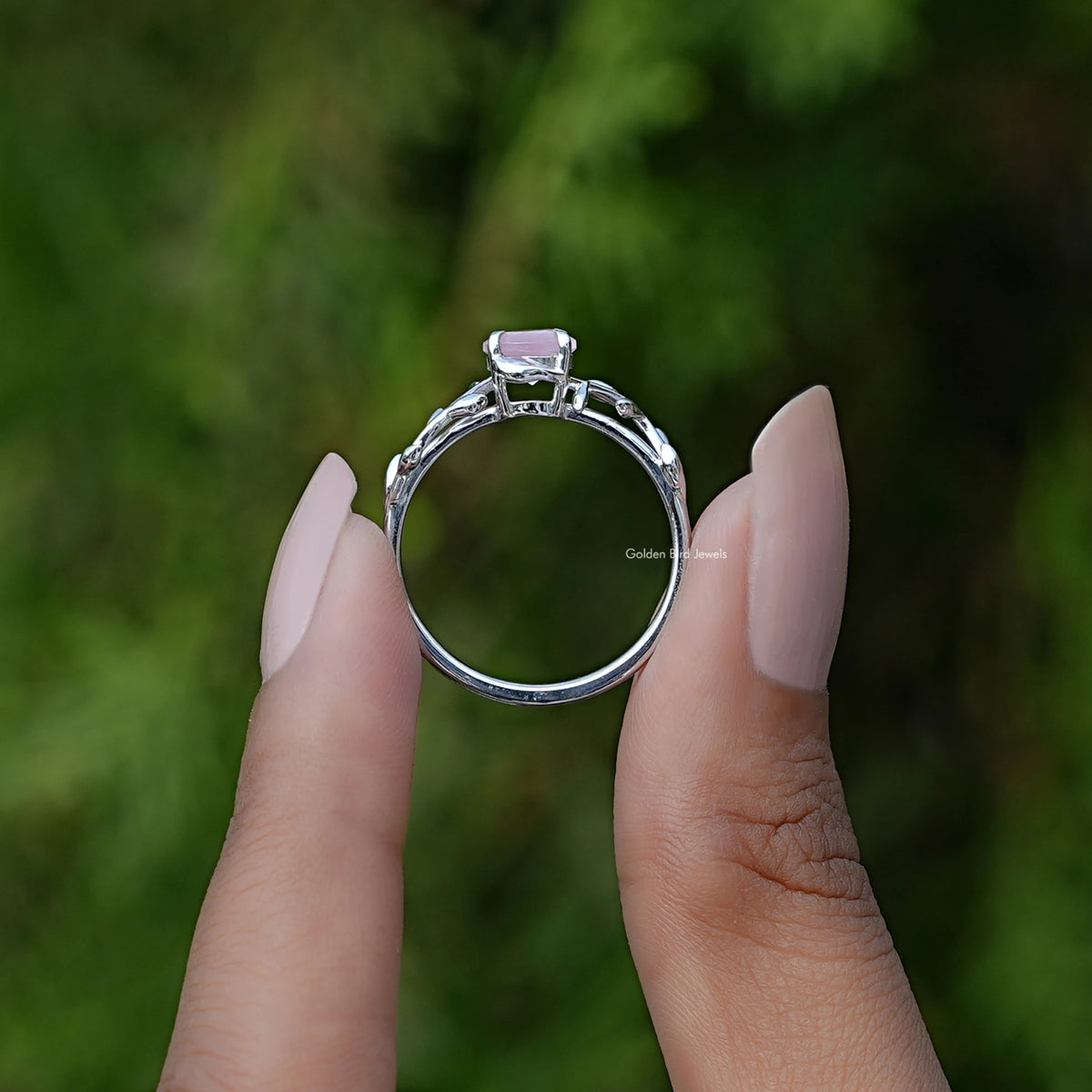 Rose quartz round gemstone leaf ring with silver band, front view