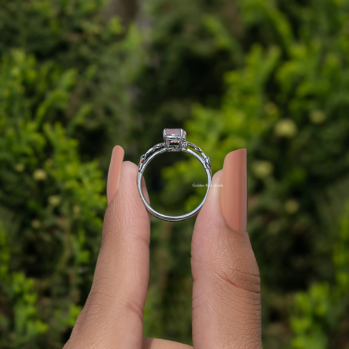 Rose quartz solitaire ring with leaf prongs and 925 Argentium silver band