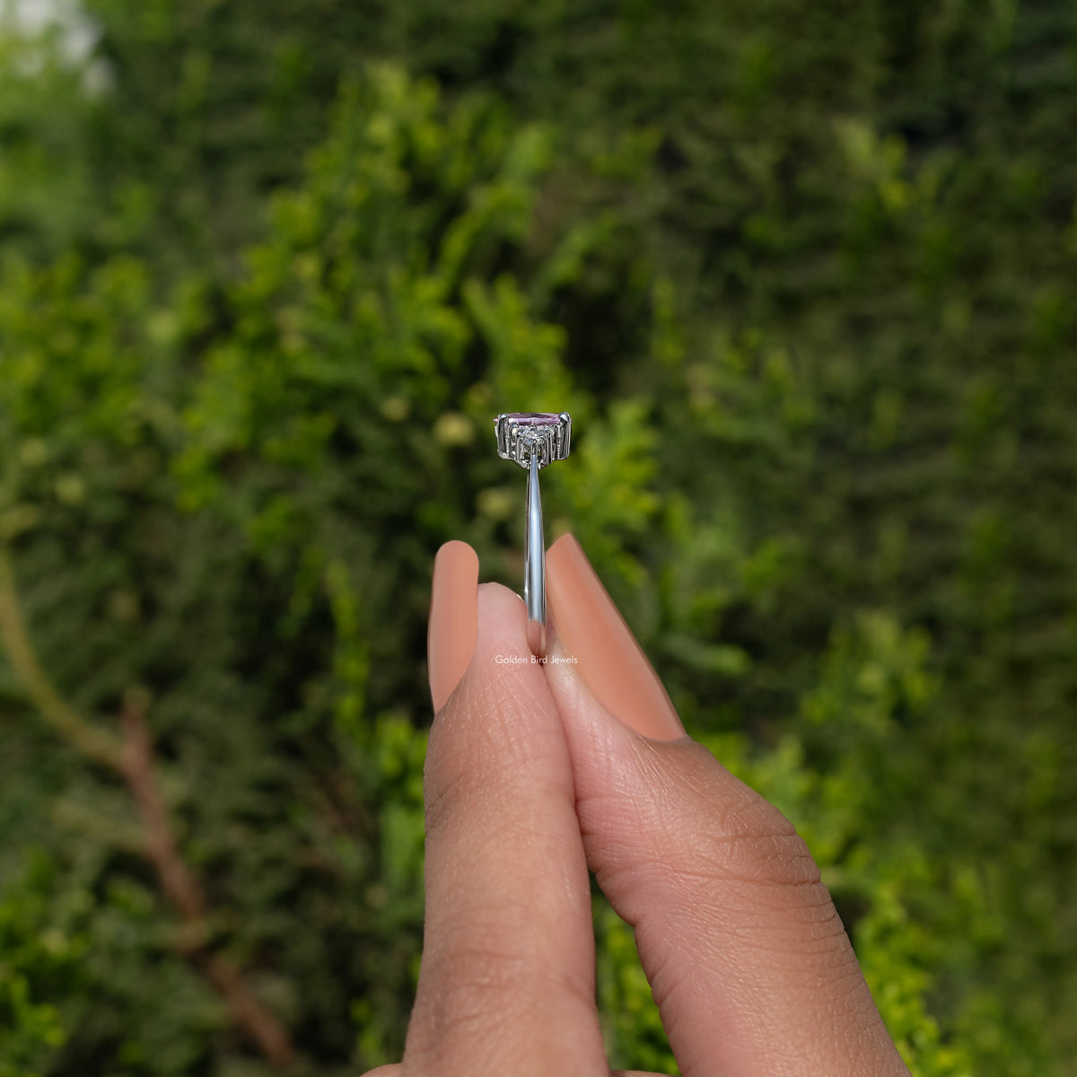Silver ring showing slim band and prong-set square gemstone top view