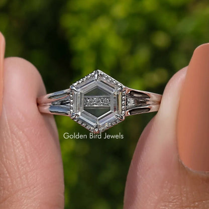 Sterling silver hexagon moissanite ring with pointed prongs and geometric bezel