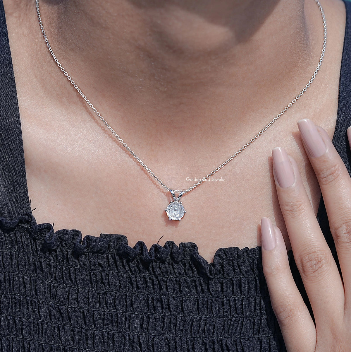 Silver round moissanite pendant necklace with prong-set stone at center of neckline