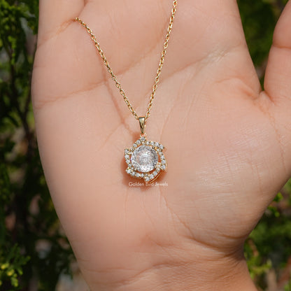 Round moissanite halo pendant on a gold-tone chain viewed from the side