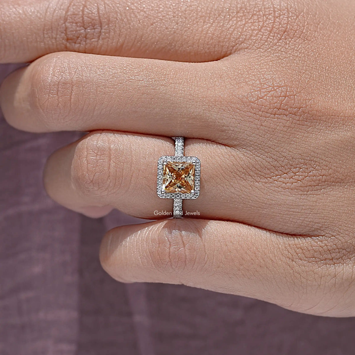 Sterling silver moissanite ring with small square halo center on close view