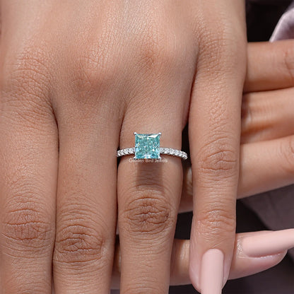 Princess cut moissanite solitaire ring with light blue square stone and pave silver band