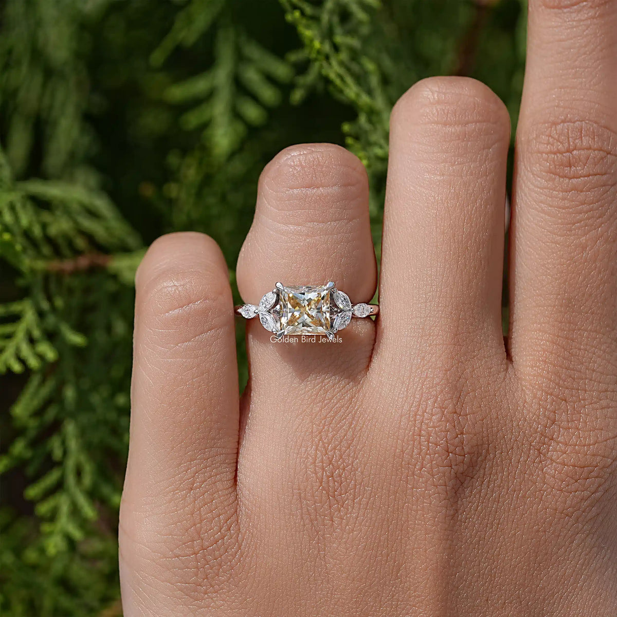 Princess-cut moissanite engagement ring with rectangular center stone and slim 925 band