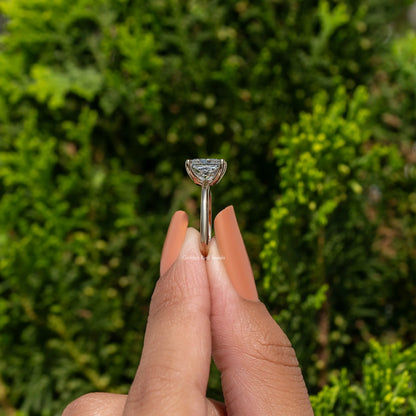 Princess-cut diamond solitaire ring with thin metal band