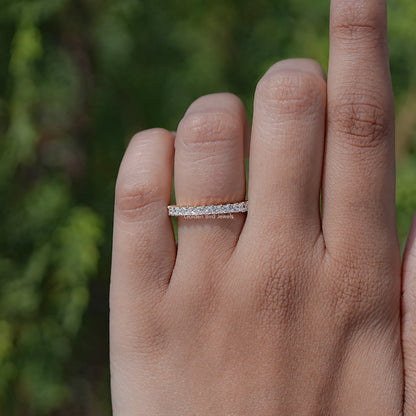 Square-cut diamond full eternity band ring on finger in silver, all-around sparkle