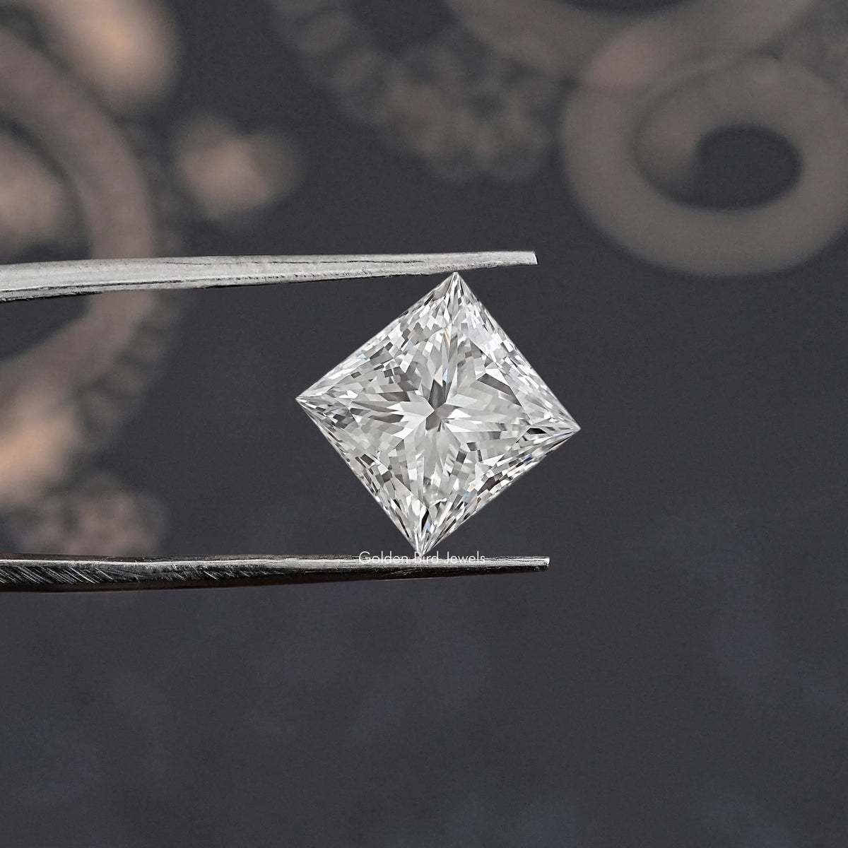 Loose princess cut lab diamond in metal tweezers, clear white princess cut square