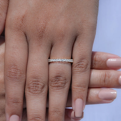 Diamond eternity band on finger, slim silver ring with square-cut stones