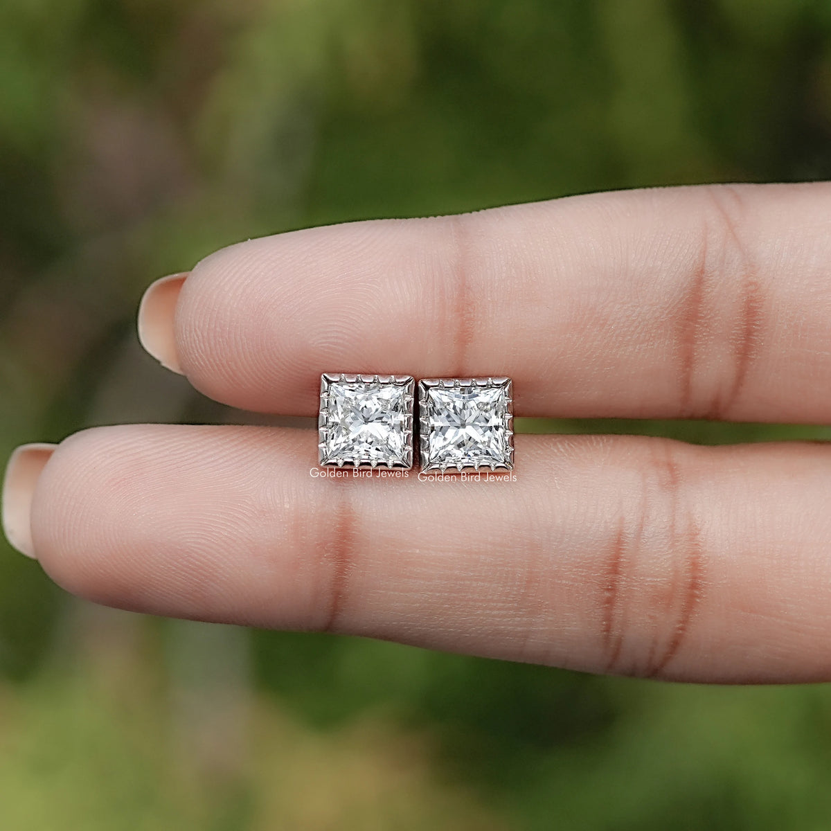 In Hand View Of Princess Cut Lab Diamond Stud Earrings