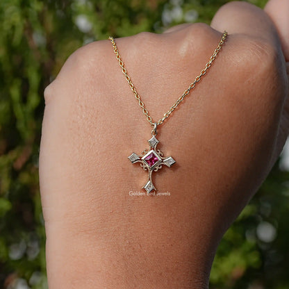 Gemstone cross pendant on gold chain, square red center stone with silver frame