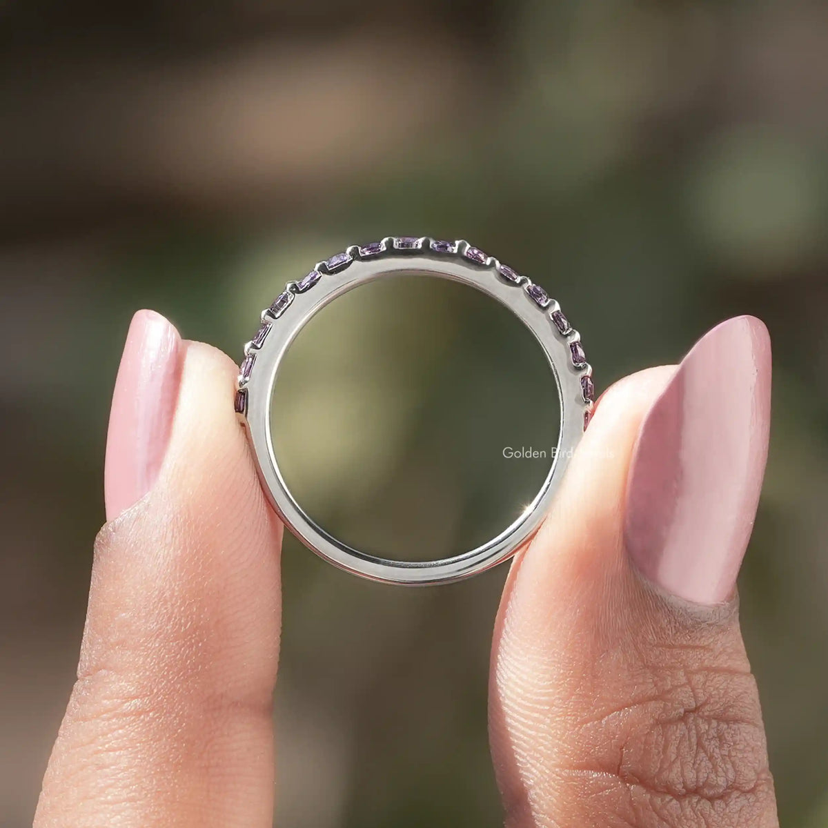 Back view of Round Cut Moissanite Solitaire Ring in secure setting 