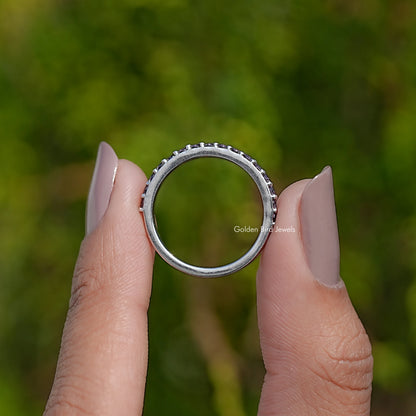 Silver amethyst eternity band ring with round purple gemstones around the band