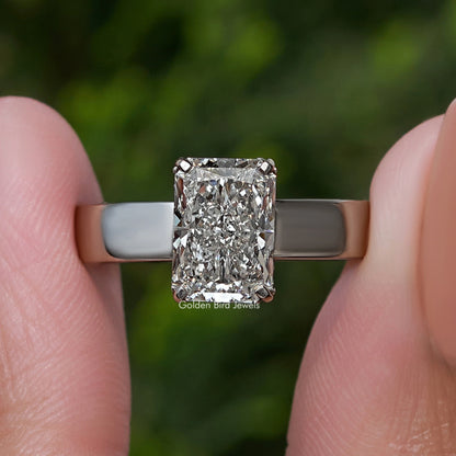 Front close-up of square-cut diamond set in silver ring band