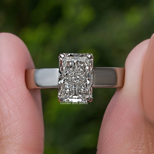 Front close-up of square-cut diamond set in silver ring band
