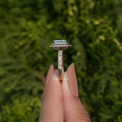 Side view of silver-toned radiant-cut engagement ring with halo details on prongs