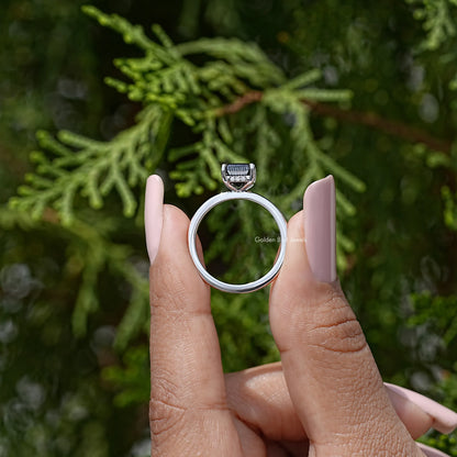 Silver ring side view with square black radiant-cut stone and hidden halo band