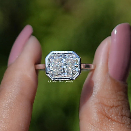 Bezel-set radiant cut moissanite engagement ring with octagonal center stone