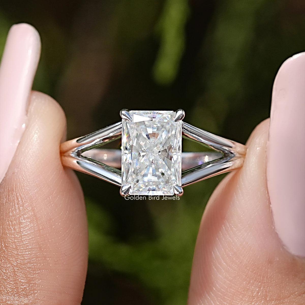 Radiant cut square moissanite center with four prongs on sterling silver split shank