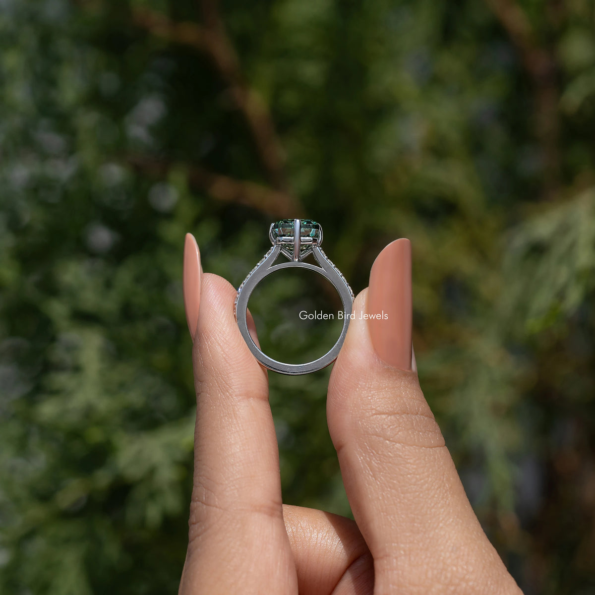 Moissanite solitaire ring back view with prongs and side diamond details